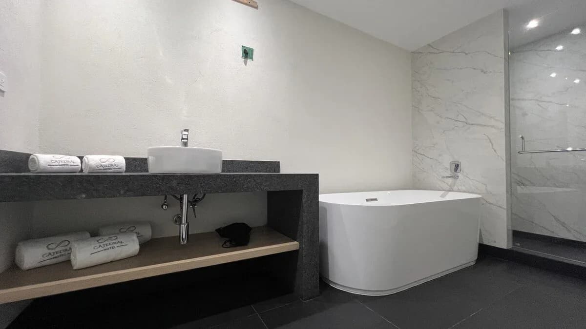 Hotel Catedral. Corner suite. Bathroom with luxury shower and deep soaking tub.